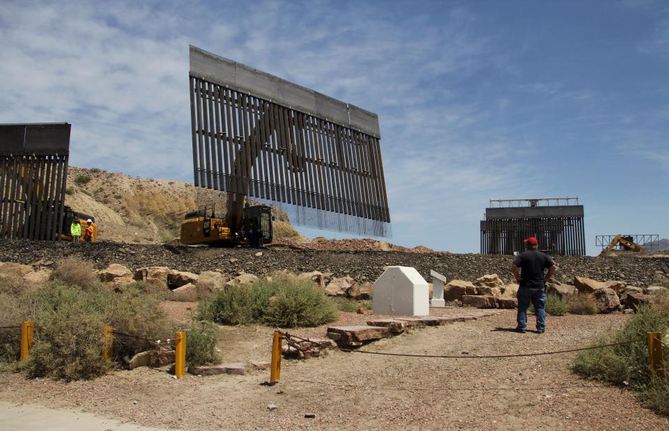 Workers build a border fence in a private property located in the limits of the US States of Texas and New Mexico taken from Ciudad Juarez, Chihuahua state, Mexico on May 26, 2019. (Photo by HERIKA MARTÍNEZ / AFP)        (Photo credit should read HERIKA MARTINEZ/AFP/Getty Images)