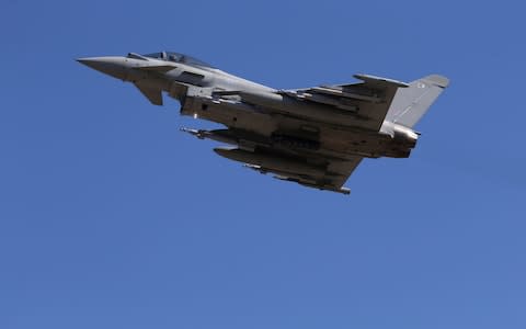 A Royal Air Force Eurofighter Typhoon fighter jet taking off from RAF's Akrotiri base in Cyprus - Credit: Petros Karadjidas/AFP