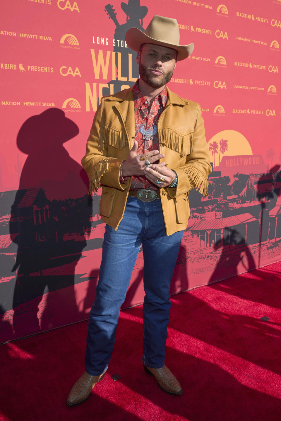 Charley Crockett arrives at Willie Nelson 90, celebrating the singer's 90th birthday, on Saturday, April 29, 2023, at the Hollywood Bowl in Los Angeles. (Photo by Allison Dinner/Invision/AP)