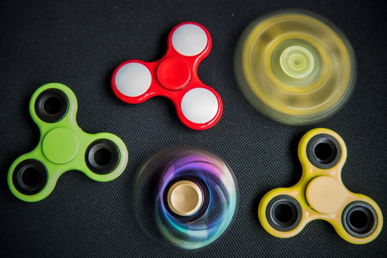 Just months after the "hand spinner" or "fidget spinner" first whirled its way into the hands of antsy youngsters, some schools have already banned it