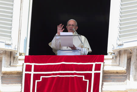 FILE PHOTO - Pope Francis make his speech during his Sunday Angelus prayer in Saint Peter's square at the Vatican, August 20, 2017. REUTERS/Alessandro Bianchi