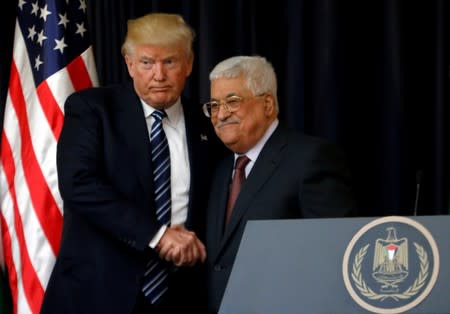 FILE PHOTO: U.S. President Donald Trump shakes hands with Palestinian President Mahmoud Abbas during a joint news conference at the presidential headquarters in the West Bank town of Bethlehem