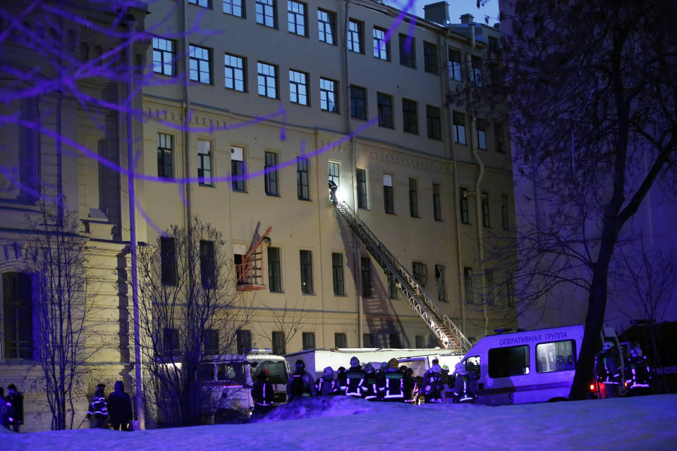 Russian Emergency employees work at the scene of the collapse building of the Saint Petersburg National Research University of Information Technologies, Mechanics and Optics in St. Petersburg, Russia, Saturday, Feb. 16, 2019. Russian emergency authorities say several floors of a university building in Russia’s second-largest city have collapsed. There was no immediate information on casualties. (AP Photo/Dmitri Lovetsky)