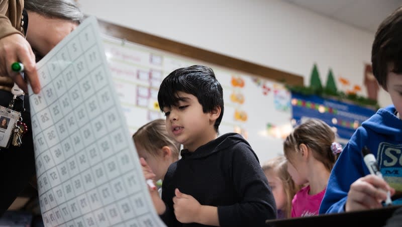 Taim Ahmed looks for a number during a math lesson during a full-day kindergarten class at East Sandy Elementary School in Sandy on Feb. 27, 2023.