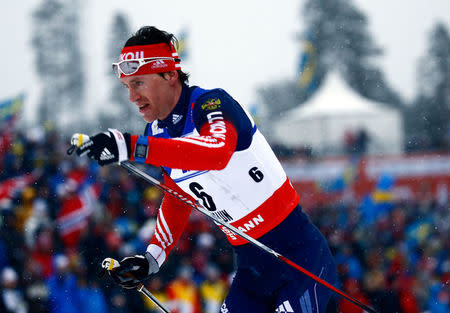 FILE PHOTO: Russia's Maxim Vylegzhanin competes in the men's cross country 50 km mass start classic race during heavy snowfall at the Nordic World Ski Championships in Falun, Sweden March 1, 2015. REUTERS/Kai Pfaffenbach/File Photo