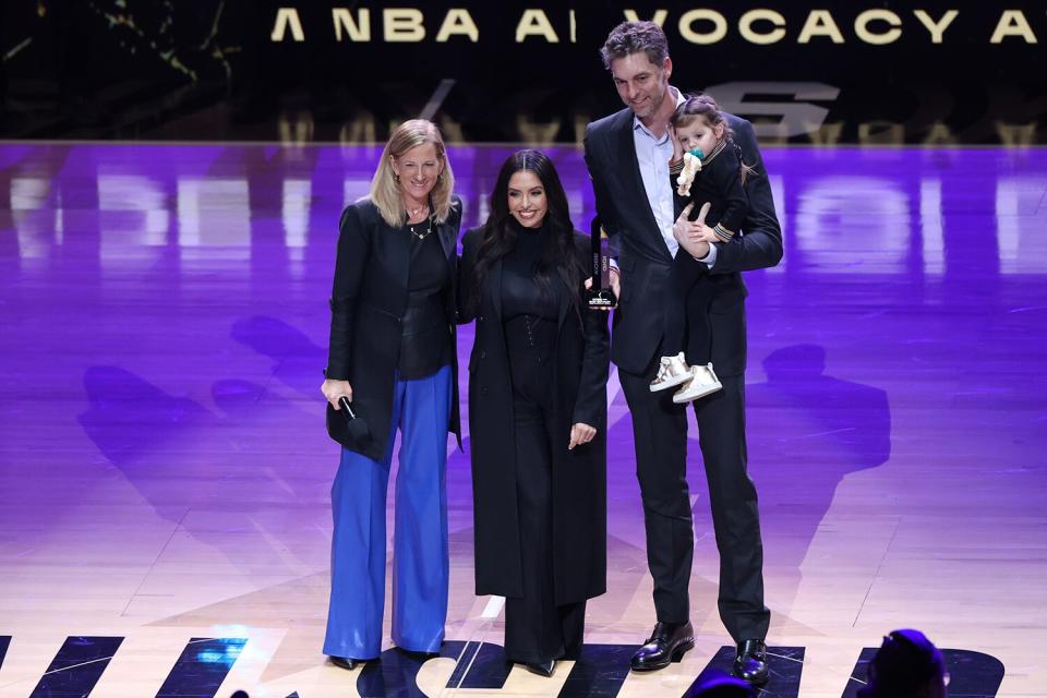 Legend Pau Gasol is presented with the 2023 Kobe and Gigi Bryant WNBA advocacy award by WNBA commissioner Cathy Engelbert and Vanessa Bryant during the NBA All-Star Game
