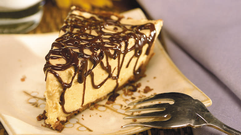 Peanut butter pie slice with chocolate drizzle