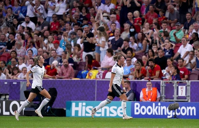 Alexandra Popp, right, celebrates scoring against Spain