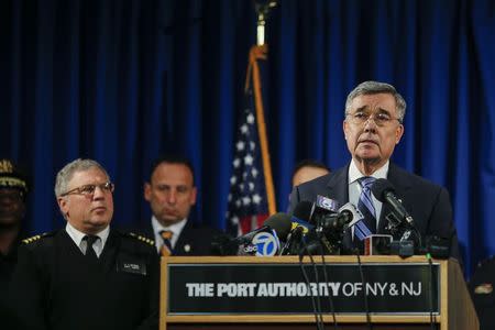 Gil Kerlikowske, (R ) Commissioner of U.S. Customs and Border Protection, speaks to the media on the implementation at JFK of enhanced screening of travelers arriving from Ebola affected countries, at the International JFK airport in New York, October 11, 2014. REUTERS/Eduardo Munoz