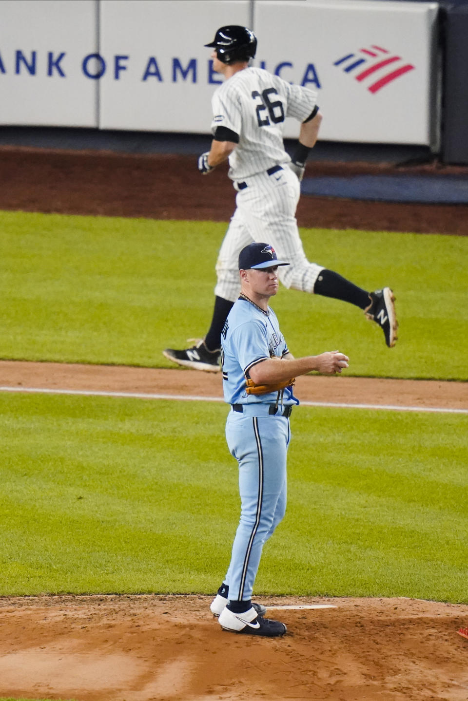 Toronto Blue Jays' Chase Anderson reacts as New York Yankees' DJ LeMahieu runs the bases after hitting a home run during the fourth inning of a baseball game Thursday, Sept. 17, 2020, in New York. (AP Photo/Frank Franklin II)