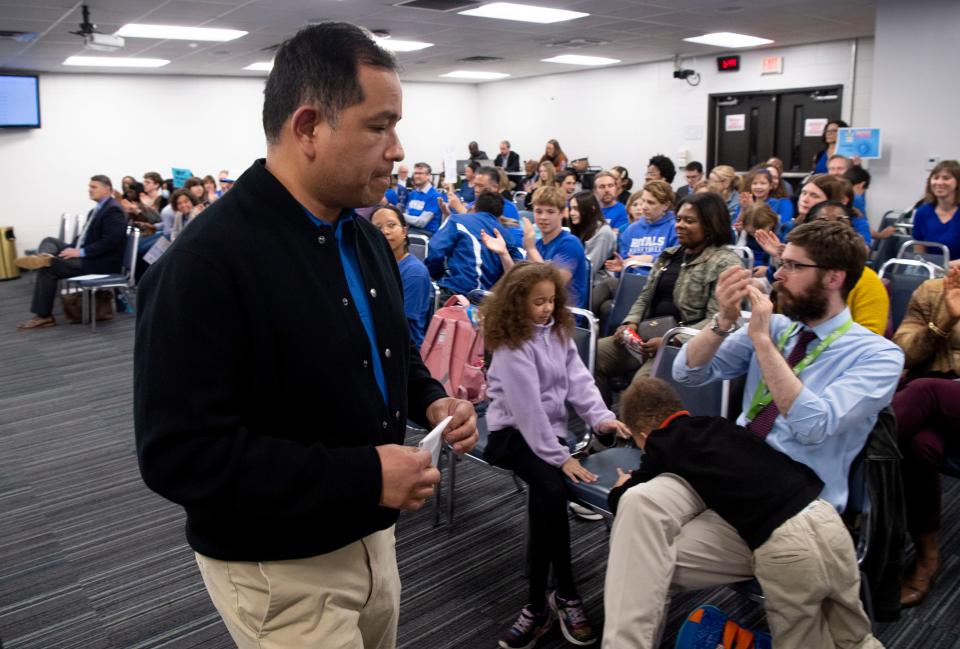 The crowd applauds after Carlos Cordova spoke during the Metro Nashville Public Schools Board of Education meeting in Nashville, Tenn., on Tuesday, Feb. 27, 2024.