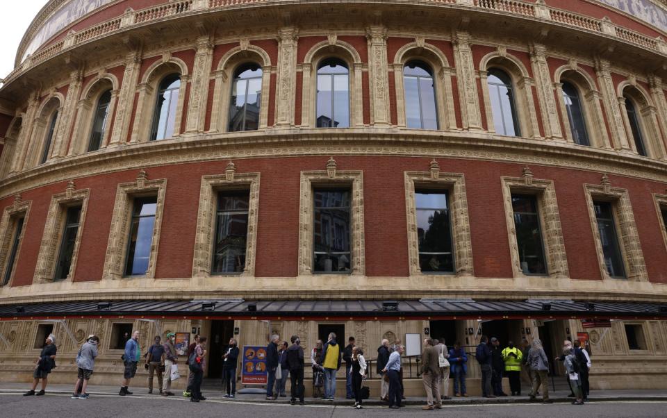 Queues outside the Royal Albert Hall which opened to music fans despite fears that the performance would be online only - HEATHCLIFF O'MALLEY