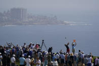 Fans watch as Hideki Matsuyama, of Japan, plays his shot from the fourth tee during the first round of the U.S. Open Golf Championship, Thursday, June 17, 2021, at Torrey Pines Golf Course in San Diego. (AP Photo/Gregory Bull)