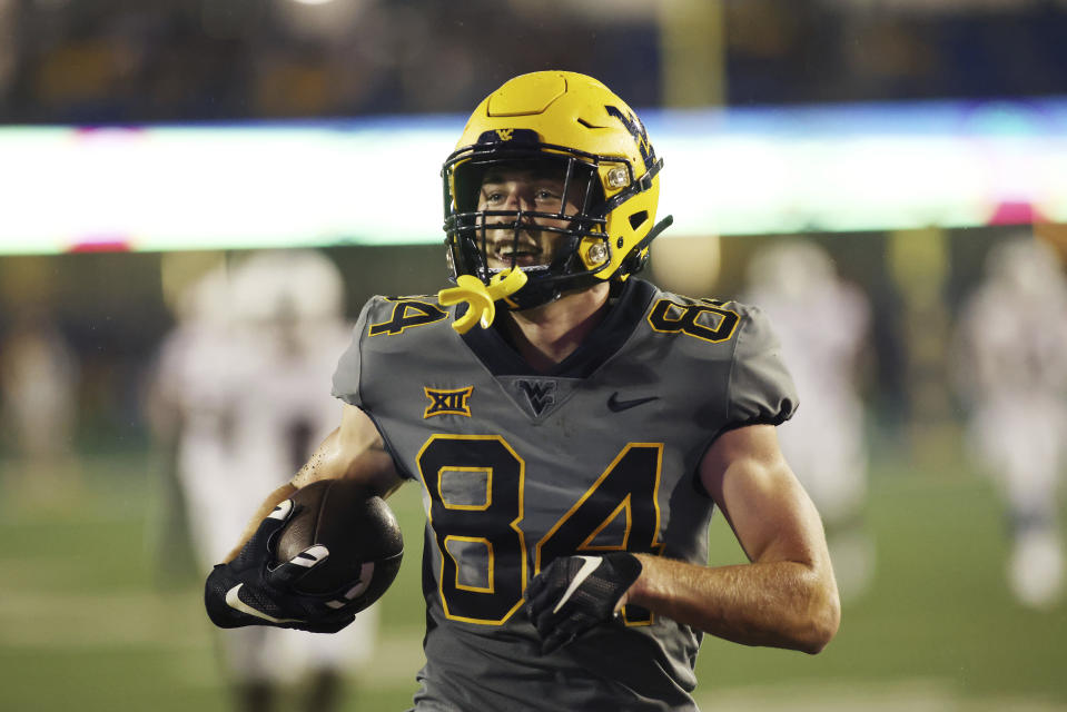 West Virginia's Hudson Clement catches a pass for a touchdown during the second half of an NCAA football game against Duquesne, Saturday, Sep. 9, 2023, in Morgantown, W.Va. (AP Photo/Chris Jackson)