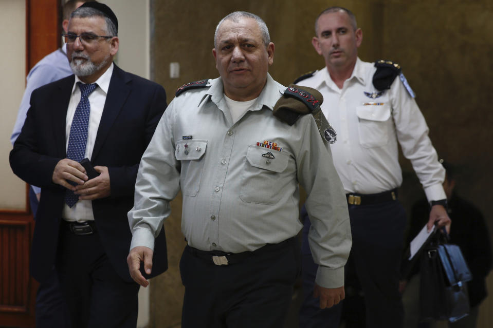 Israeli Chief of Staff Lt. Gen. Gadi Eizenkot, center, ‏arrives for the weekly cabinet meeting in Jerusalem, Sunday, Jan. 13, 2019. (AP Photo/Ariel Schalit, Pool)