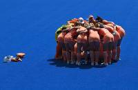 <p>Players of Netherlands gather before their women's semi-final match of the Tokyo 2020 Olympic Games field hockey competition against Britain, at the Oi Hockey Stadium in Tokyo, on August 4, 2021. (Photo by Tauseef MUSTAFA / AFP)</p> 