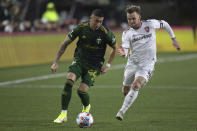 Portland Timbers midfielder Marvin Loria (44) and Real Salt Lake midfielder Albert Rusnák (11) vie for the ball during the first half of the MLS soccer Western Conference final Saturday, Dec. 4, 2021, in Portland, Ore. (AP Photo/Amanda Loman)