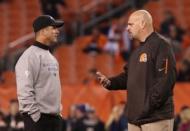 Baltimore Ravens head coach John Harbaugh (left) talks with Cleveland Browns head coach Mike Pettine prior to the game at FirstEnergy Stadium. The Ravens won 33-27. Mandatory Credit: Aaron Doster-USA TODAY Sports