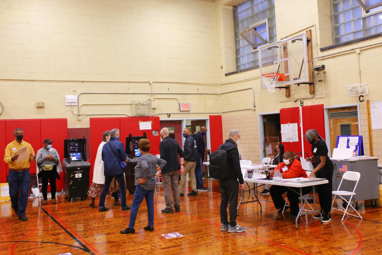 People check in as they prepare to vote on Election Day at P.S. 11 Purvis J. Behan Elementary on Nov. 02, 2021, in the Clinton Hill neighborhood of Brooklyn.