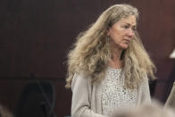 Karen Wilson, mother of Anna Moriah Wilson, looks at Kaitlin Armstrong after Armstrong was sentenced to 90 years in prison for Wilson's murder at the Blackwell-Thurman Criminal Justice Center on Friday, Nov. 17, 2023, in Austin, Texas. Armstrong was found guilty of killing Anna "Mo" Wilson in May 2022. (Mikala Compton/Austin American-Statesman via AP, Pool)