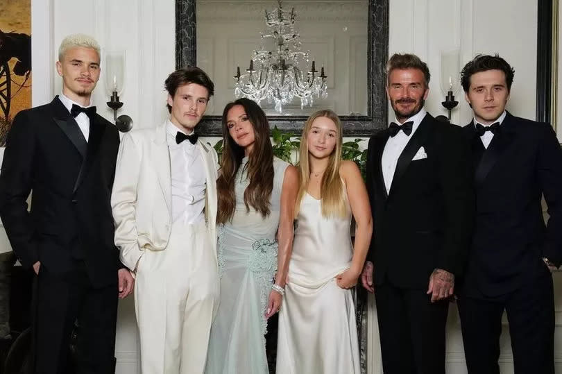 The Beckhams pose for a picture at Victoria's 50th