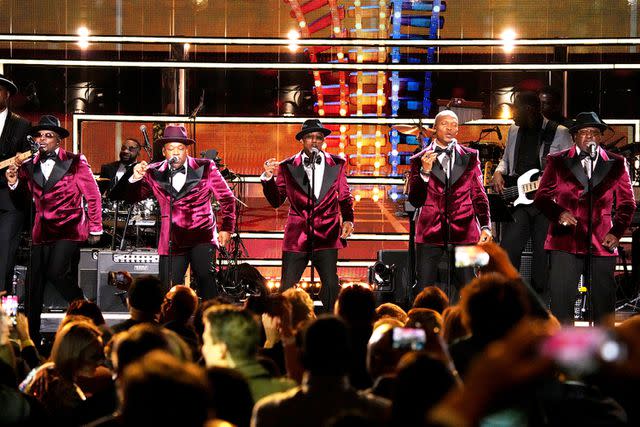 <p>Jeff Kravitz/FilmMagic</p> From left: Ricky Bell, Michael Bivens, Ralph Tresvant, Ronnie DeVoe and Bobby Brown of New Edition perform onstage at the 38th Annual Rock & Roll Hall Of Fame Induction Ceremony in November 2023