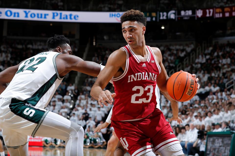 Indiana's Trayce Jackson-Davis, right, drives against Michigan State's Mady Sissoko during the first half of an NCAA college basketball game, Tuesday, Feb. 21, 2023, in East Lansing, Mich.