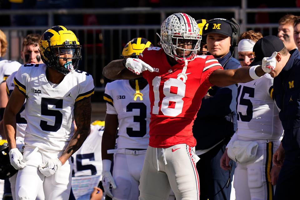 Ohio State wide receiver Marvin Harrison Jr. (18) celebrates a first down against Michigan. (Adam Cairns, The Columbus Dispatch)