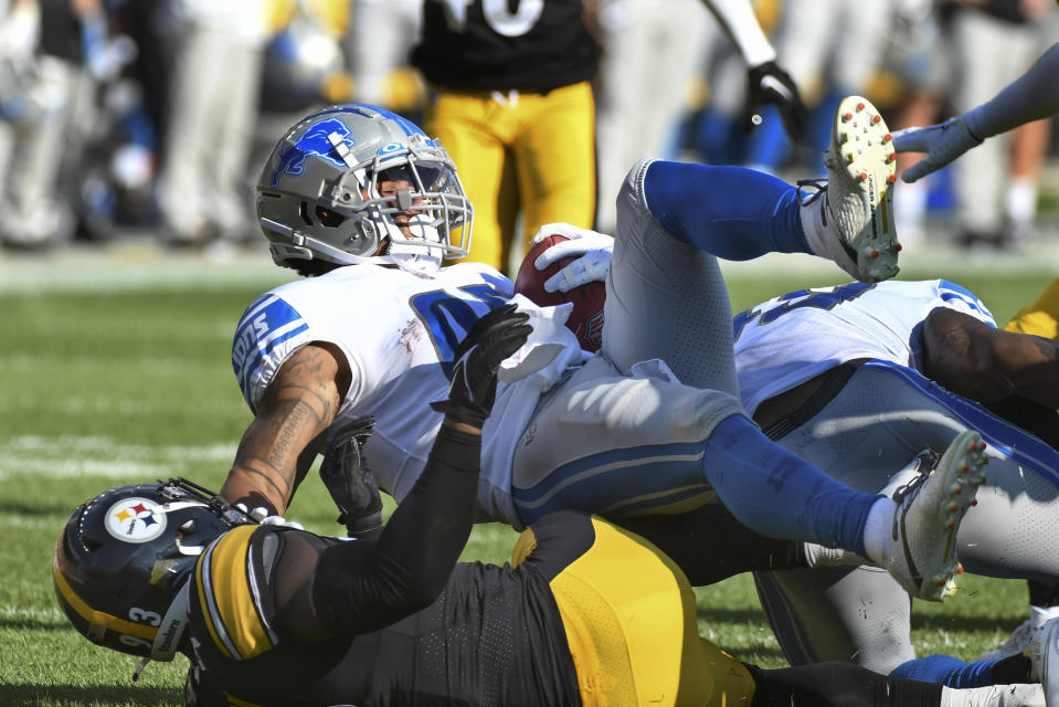 Pittsburgh Steelers linebacker Mark Robinson (93) brings down Detroit Lions running back Justin Jackson (42) during the first half of an NFL preseason football game, Sunday, Aug. 28, 2022, in Pittsburgh. (AP Photo/Fred Vuich)