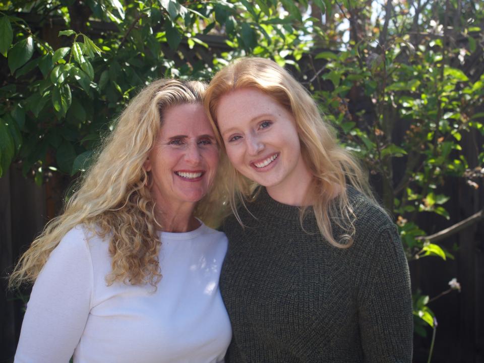 This May 1, 2020 photo shows Carrie Green-Zinn, left, and her daughter, Zaria Zinn in Alameda, Calif. With decorations and virtual tours, Zinn, 23, and her younger sister plan to turn the family home into an around-the-world trip for their mom on Mother’s Day. Isolation due to the coronavirus outbreak has led families to find creative ways to celebrate. (AP Photo via Aleeza Zinn)