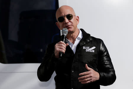 Amazon and Blue Origin founder Jeff Bezos addresses the media about the New Shepard rocket booster and Crew Capsule mockup at the 33rd Space Symposium in Colorado Springs, Colorado, United States April 5, 2017. REUTERS/Isaiah J. Downing