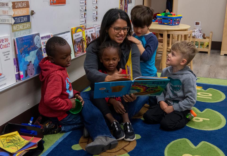 Yasmin Marcano, a teacher with Head Start program at the Evansville Community Action Program, reads a book to her students Tuesday morning, Nov. 8, 2022. Like many other former Venezuelans, she came to the U.S. because her family was victimized by political persecution and harassment. Their lives were in danger."Today Venezuela is experiencing one of the worst crises in its history," she said.