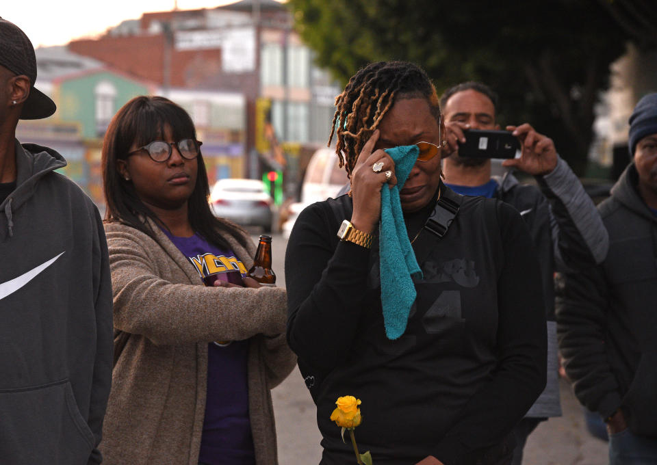 LOS ANGELES, CALIFORNIA - JANUARY 26: Distraught Los Angeles Lakers fan Naima Smith (wearing glasses) crying at a vigil for the late NBA star Kobe Bryant on January 26, 2020 in Los Angeles, California. (Photo by Michael Tullberg/Getty Images)