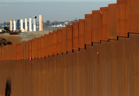 The prototypes for U.S. President Donald Trump's border wall are seen behind the border fence between Mexico and the United States, in Tijuana, Mexico January 7, 2019. REUTERS/Jorge Duenes