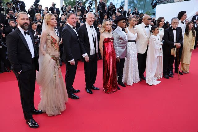 <p>Neilson Barnard/Getty</p> From Left: Shia LaBeouf, Grace VanderWaal, D. B. Sweeney, Jon Voight, Chloe Fineman, Giancarlo Esposito, Nathalie Emmanuel, Laurence Fishburne, Kathryn Hunter, Aubrey Plaza, Francis Ford Coppola, Adam Driver and Talia Shire at the Cannes Film Festival on May 16, 2024