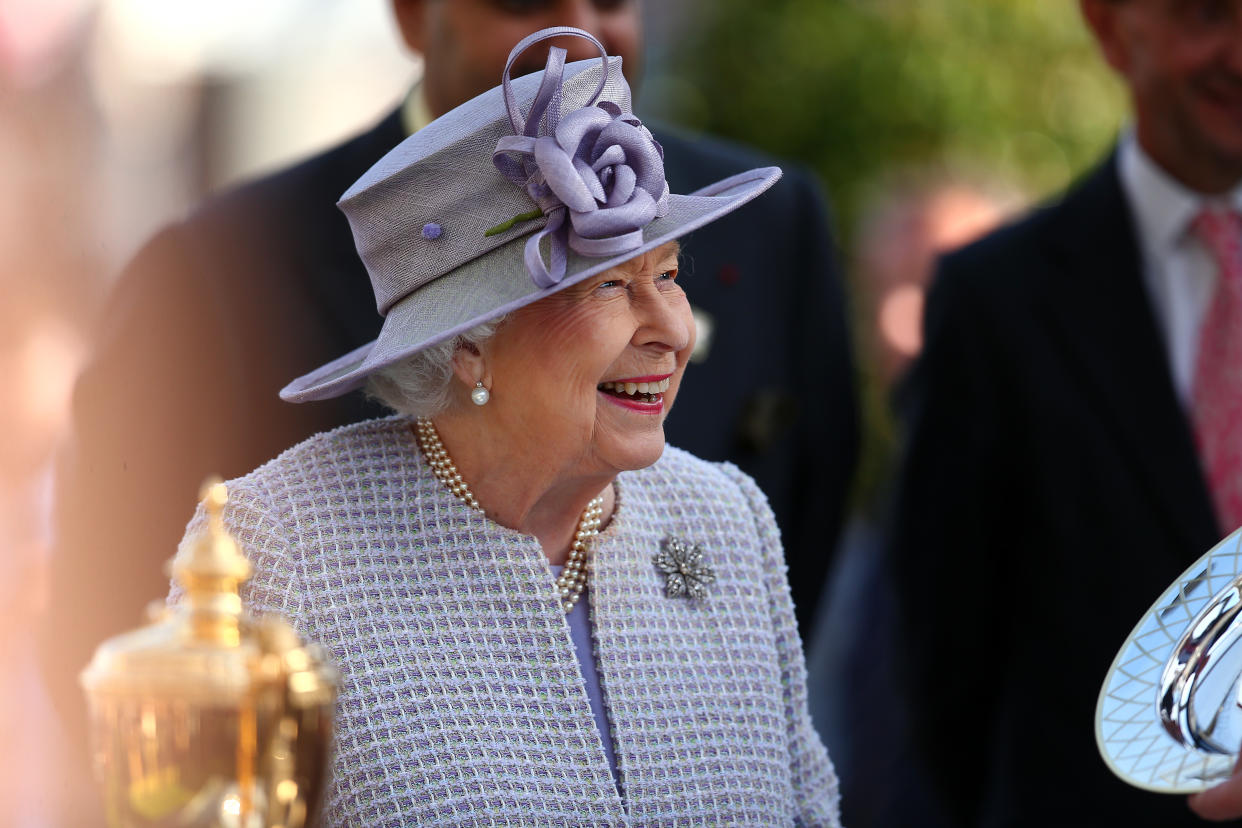 ASCOT, ENGLAND - OCTOBER 19: Queen Elizabeth II presents Sean Levey winner of The Queen Elizabeth II Stakes with his trophy during the QIPCO British Champions Day at Ascot Racecourse on October 19, 2019 in Ascot, England. (Photo by Charlie Crowhurst/Getty Images)