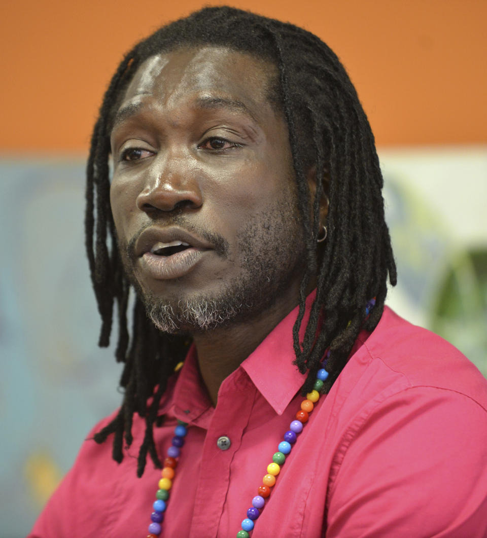 Ugandan gay-rights activist John Abdallah Wambere speaks during a news conference Tuesday, May 6, 2014 in Boston. Wambere is seeking asylum in the U.S. to escape a harsh anti-homosexual law in his home country. The 41-year-old Wambare who now lives in Cambridge said Tuesday it is heartbreaking he will have to leave his community at home as well as his 16-year-old daughter, but it is too dangerous to return. (AP Photo/Josh Reynolds)