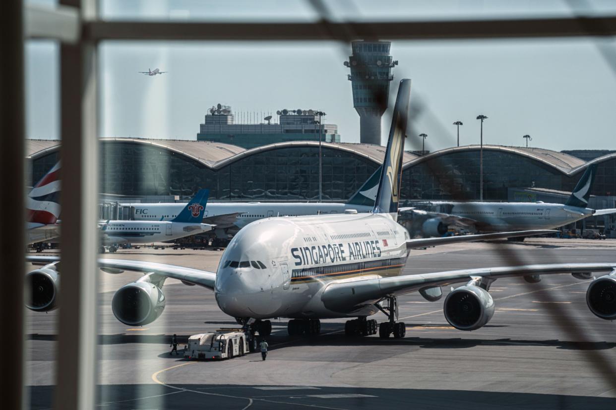 A Singapore Airlines Ltd. aircraft on the tarmac at Hong Kong International Airport in Hong Kong, China, on Wednesday, May 3, 2023. 
