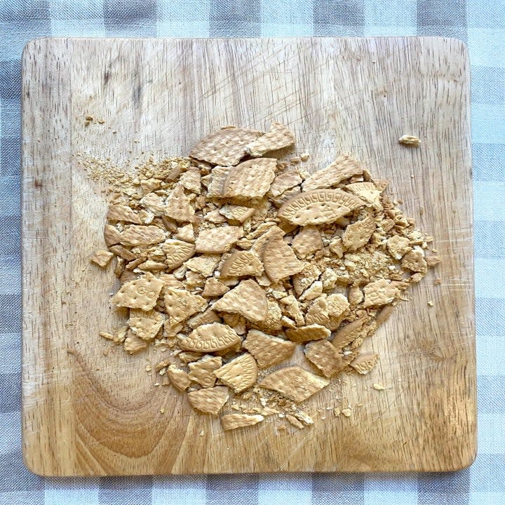 crushed cookies on a cutting board