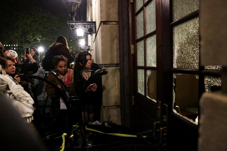 PHOTO: People and protesters look on as protesters barricade themselves inside Hamilton Hall at Columbia University in New York City, April 30, 2024. (Caitlin Ochs/Reuters)