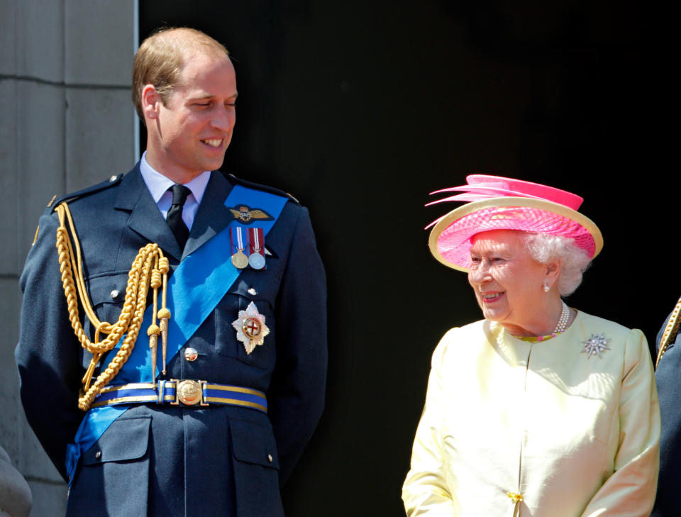 Prince William, Duke of Cambridge and Queen Elizabeth II watch a flypast of Spitfire & Hurricane aircraft from the balcony of Buckingham Palace to commemorate the 75th Anniversary of The Battle of Britain on July 10, 2015 in London, England.