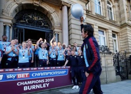 Britain Soccer Football - Burnley - Sky Bet Football League Championship Winners Parade - Burnley - 9/5/16 Burnley's Joey Barton celebrates with a blow up trophy after winning the Sky Bet Football League Action Images via Reuters / Carl Recine