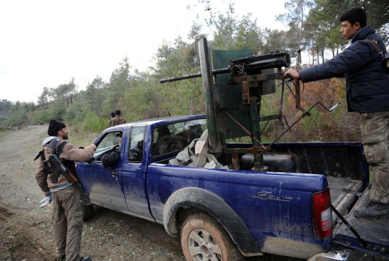 Syrian rebels take position on the Jabal al-Turkman mountain in Syria's northern Latakia province on February 5, 2013