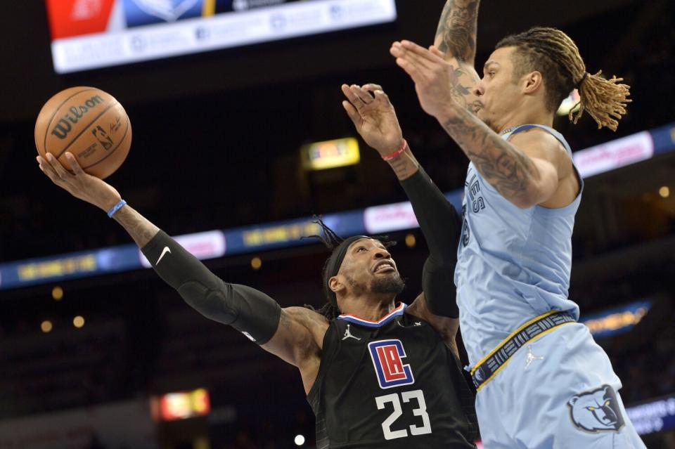 Robert Covington shoots against Memphis Grizzlies' Brandon Clarke on Feb. 8 at FedExForum.