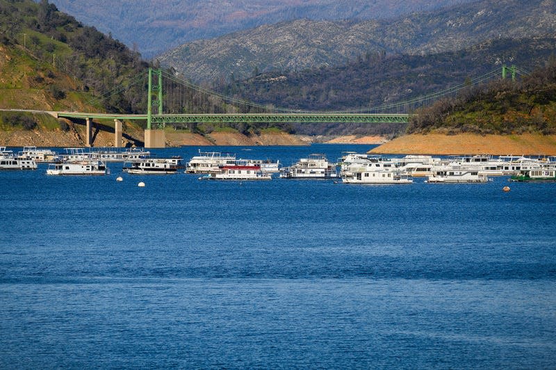 Houseboats float near Lake Oroville’s Bidwell Bar Bridge at on March 26 2023, in Butte County, California. 