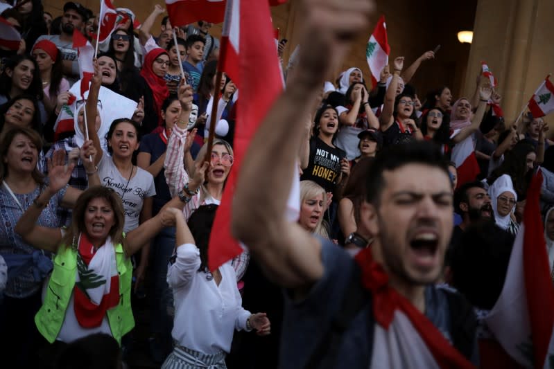 Demonstrators shout slogans during an anti-government protest in downtown Beirut