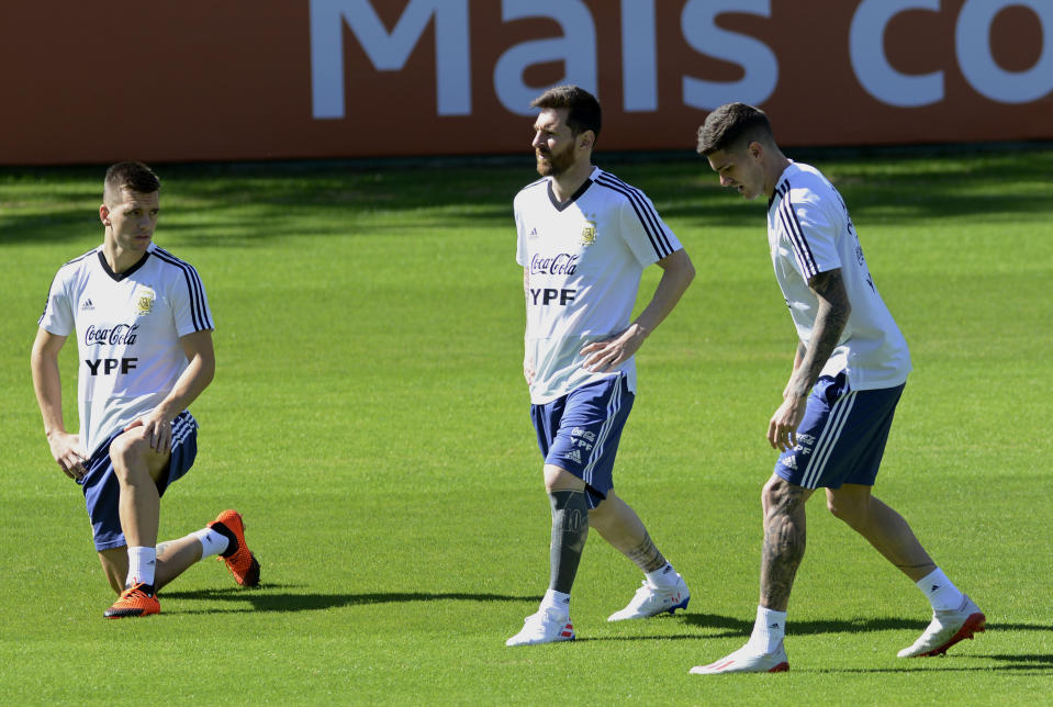 Argentina's Lionel Messi, center, warms up during a practice session of the national soccer team in Belo Horizonte, Brazil, Tuesday, June 18, 2019. Argentina will face Paraguay tomorrow in a Copa America Group B soccer match. (AP Photo/Eugenio Savio)