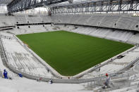 Arena da Baixada continues under construction in Curitiba, Brazil, Tuesday, Feb. 18, 2014. The southern Brazilian city will host matches during this year's World Cup despite serious problems in the renovation of its stadium that put it on the brink of becoming the first venue ever to be kicked out because of delays, FIFA Secretary General Jerome Valcke said Tuesday. (AP Photo/Denis Ferreira Netto)