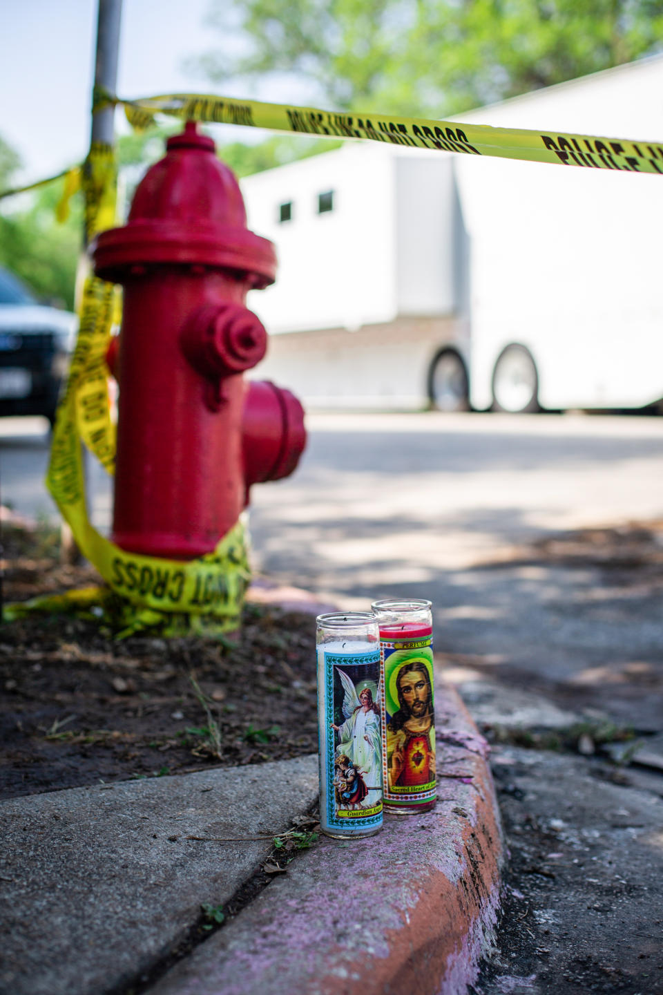 Candles reside on the curb for the victims of a mass shooting yesterday at Robb Elementary School, on May 25, 2022 in Uvalde, Texas. (Liz Moskowitz for NBC News)