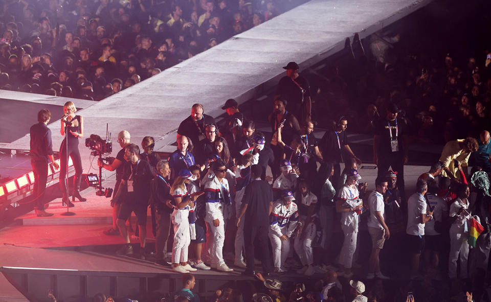 Athletes, pictured here being escorted off stage by security staff.